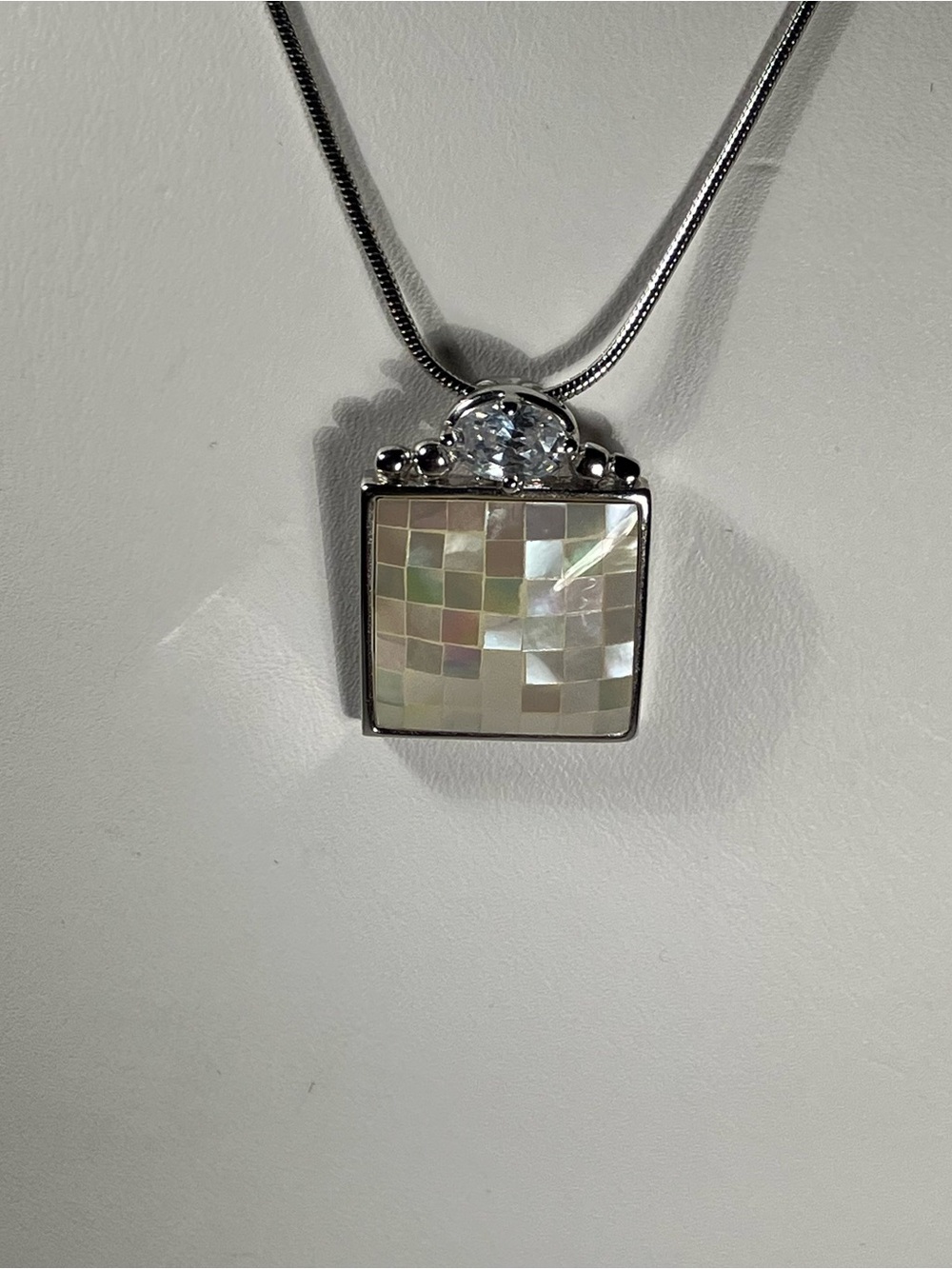 Genuine mother of pearl necklace with half carat cubic zirconia, mosaic design